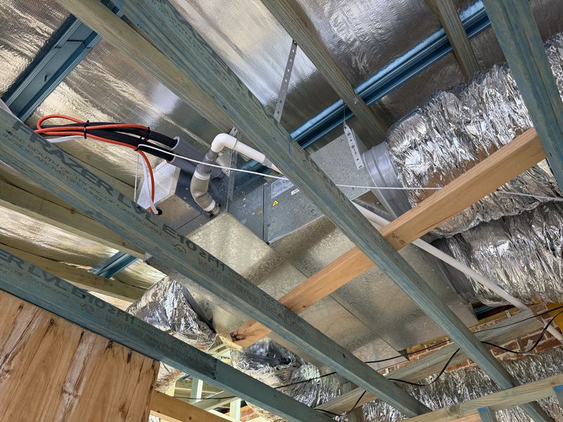 Rough-in: ducted indoor unit suspended in the ceiling, with refrigerant, drain and power connections, Botany, NSW